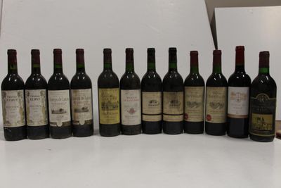 many bottles of wine lined up on the counter