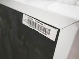 a black and white picture of a refrigerator with a barcode on it