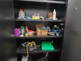 a metal cabinet with a lot of items on it