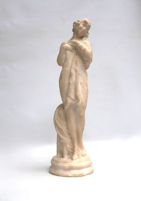 statue of a woman holding a dog on a white background