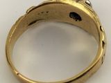 an image of a gold ring with a diamond in the center