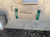 a metal box sitting on the side of the road