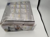 a box of wii games sitting on a white table