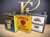 three cans that are sitting next to each other on a table