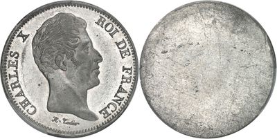 Gros plan sur une pièce de monnaie portant le visage d'un homme
