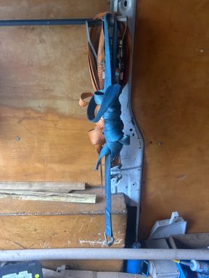 a picture of a tool rack with a wrench hanging from it ' s side