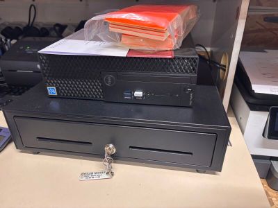 an image of a cash register sitting on top of a counter