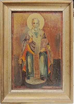 an old painting of a man with a beard holding a book