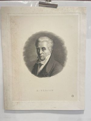 an old picture of a man in a suit and tie is hanging on a wall