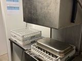 a kitchen with a sink and a dishwasher in it