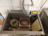 a sink that has a lot of dirty dishes in it