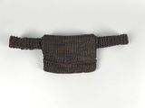 a close up of a knitted belt bag on a white surface