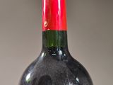 a bottle of wine that is sitting on a table