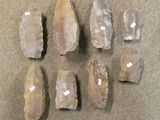 several pieces of rock sitting on top of a table next to each other