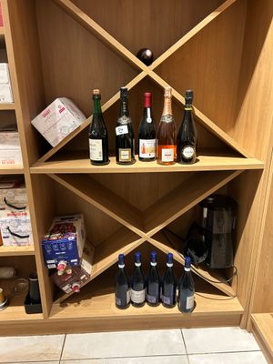 many bottles of wine on the shelves in the wine cellar