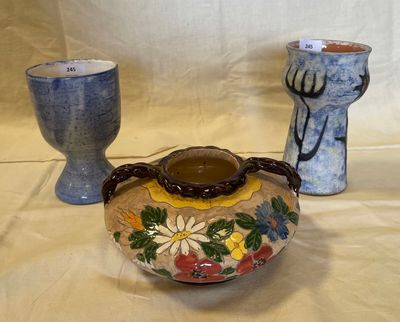 two vases sitting next to each other on a table
