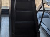 a tread machine that is sitting in front of a window