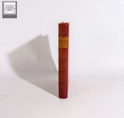 a red book sitting on top of a white table