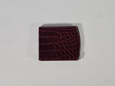 LANCEL. Etui en cuir et métal argenté.