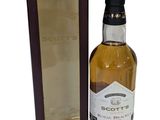 a bottle of scotch whisky sitting next to a cardboard box