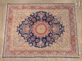 an oriental rug with a medallion design on a wooden floor