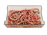 a glass tray with a bunch of beads on it