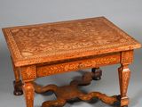an old wooden table with a drawer on top of it