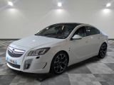 a picture of a white car in a showroom