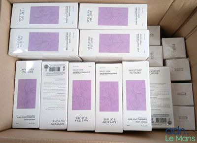 several boxes of white and purple paper are stacked on top of each other