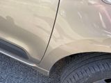a close up of a car ' s front bumper and tire