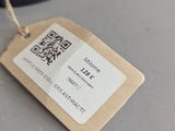 a tag that is attached to a lamp on a table