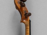an old violin with a wooden back and a long neck