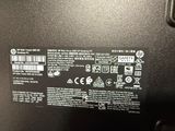 a close up of the back of a laptop with a sticker on it