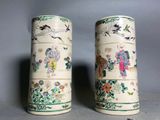 pair of chinese vases with birds and flowers painted on them