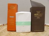 two bottles of vanilla milk and a box of vanilla milk on a table