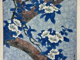 a painting of blue and white flowers on a tree branch