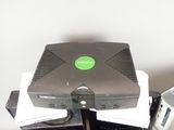an image of a computer with a green button on top of it