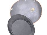 a black hat and a black plate on a white surface