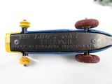 a toy skateboard that is sitting on a white surface