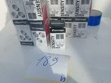 many boxes of toilet paper on a table with a note