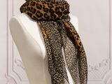 a close up of a mannequin with a leopard print scarf on it