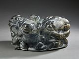 a statue of a group of animals sitting on a table
