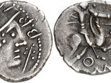a close up of a silver coin with a bird on it