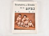 a book with a picture of a group of dolls on it