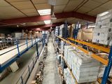a large warehouse filled with lots of boxes and pallets