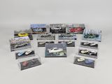 many different models of cars on display in a display case