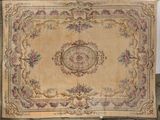 an old rug with a floral design on it on a table