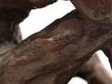 a bronze statue of a man holding a bird on his arm