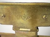 a close up of a brass plate with a metal handle