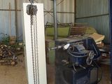 a machine that is sitting inside of a building next to a pallet
